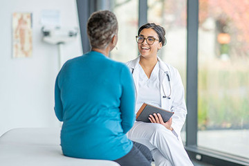 IME doctor talking with patient